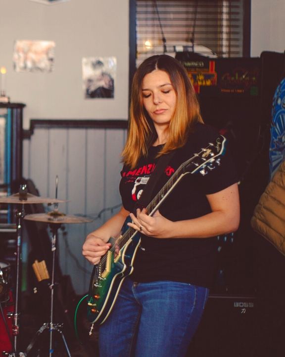 Alli Playing Guitar